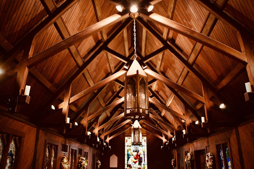 people in a room with brown wooden ceiling