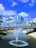 water fountain near green and blue dome building under blue sky during daytime