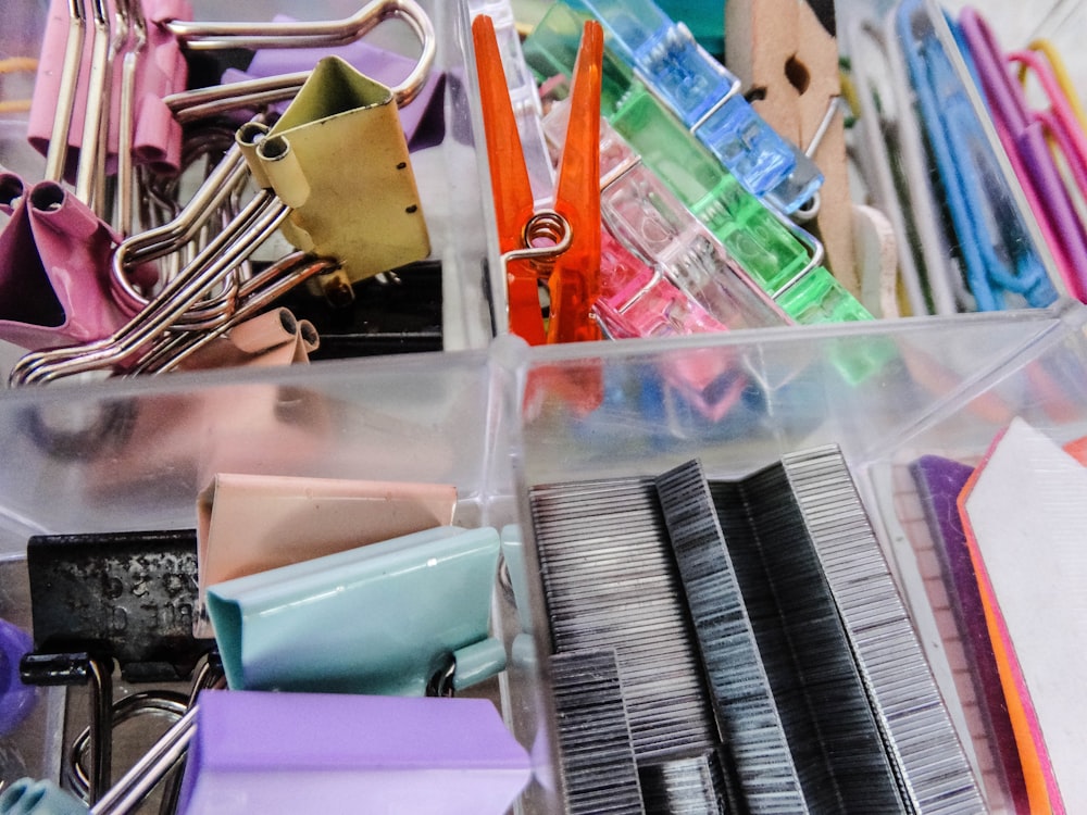 assorted color plastic container on stainless steel rack