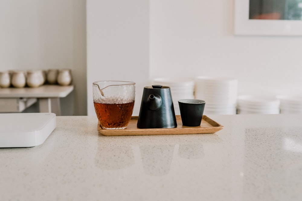 2 clear drinking glasses on white table