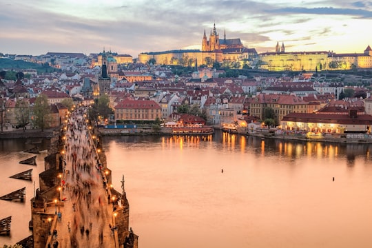 brown concrete building near body of water during daytime in Praha Czech Republic