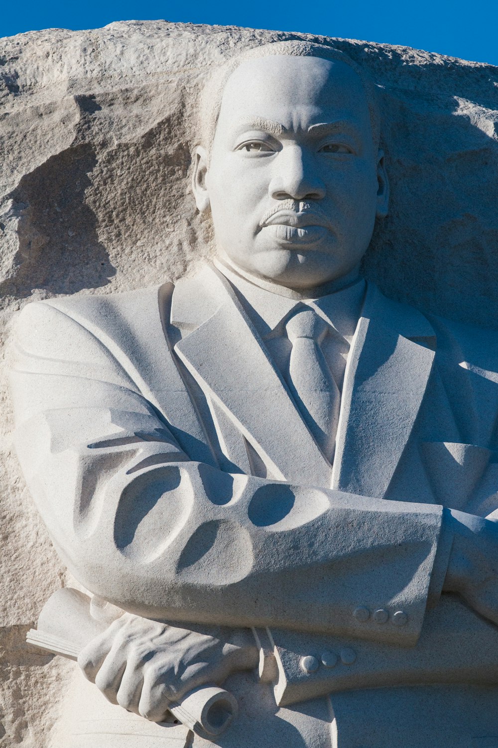 man in white suit jacket