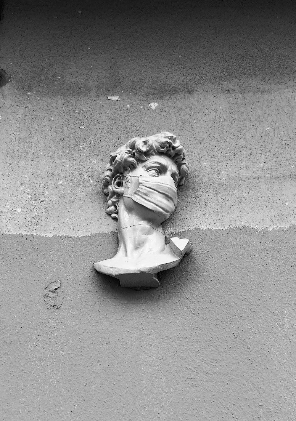 woman in dress statue on gray concrete floor