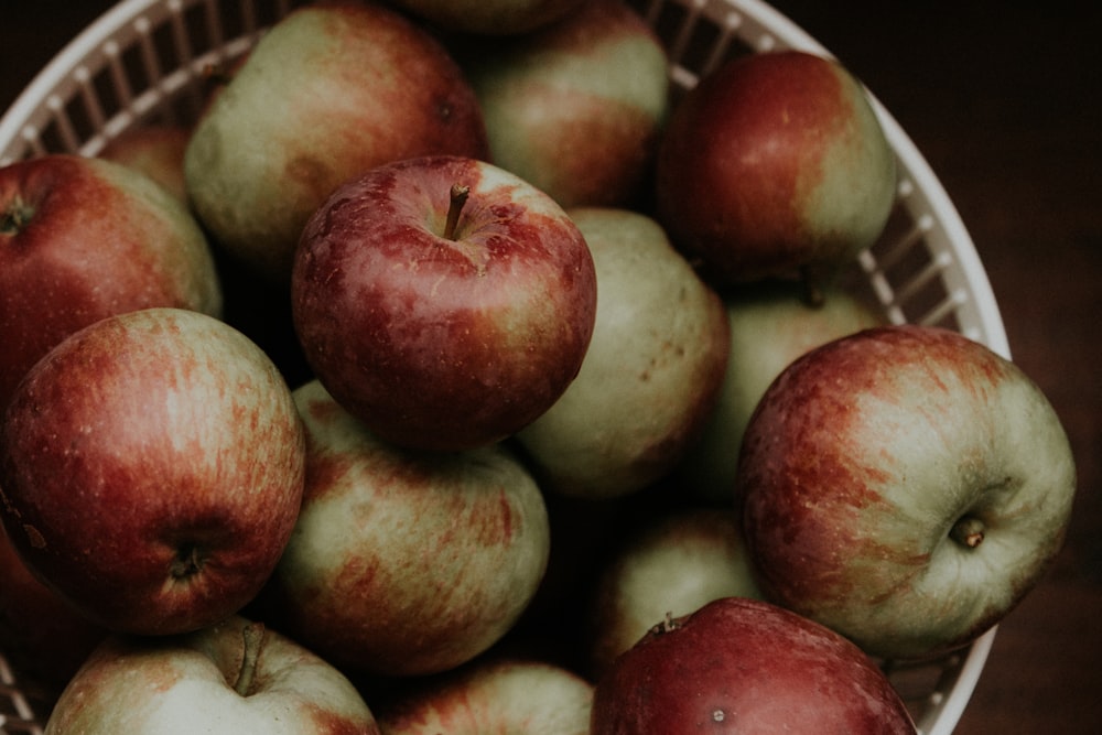 red apples on white plastic container