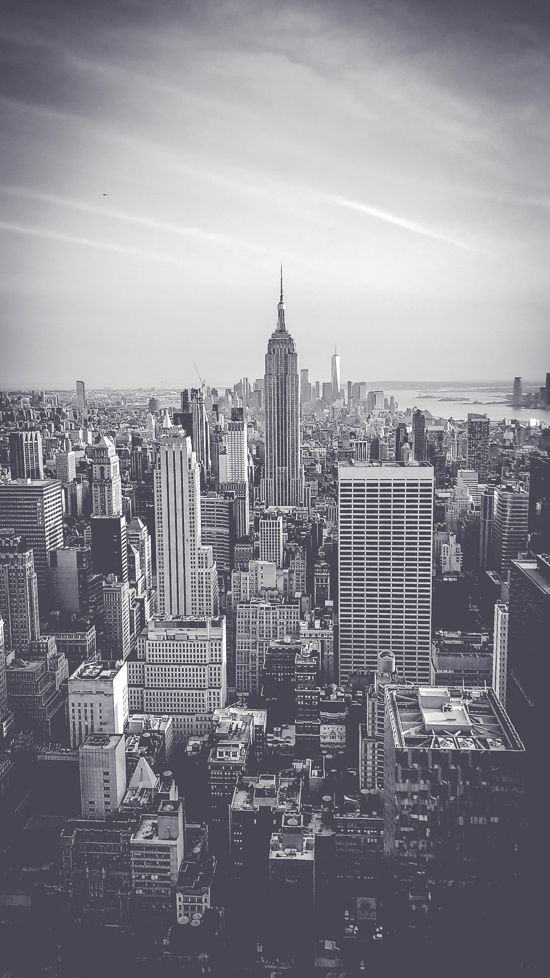 grayscale photo of city buildings