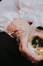 person wearing silver and gold ring