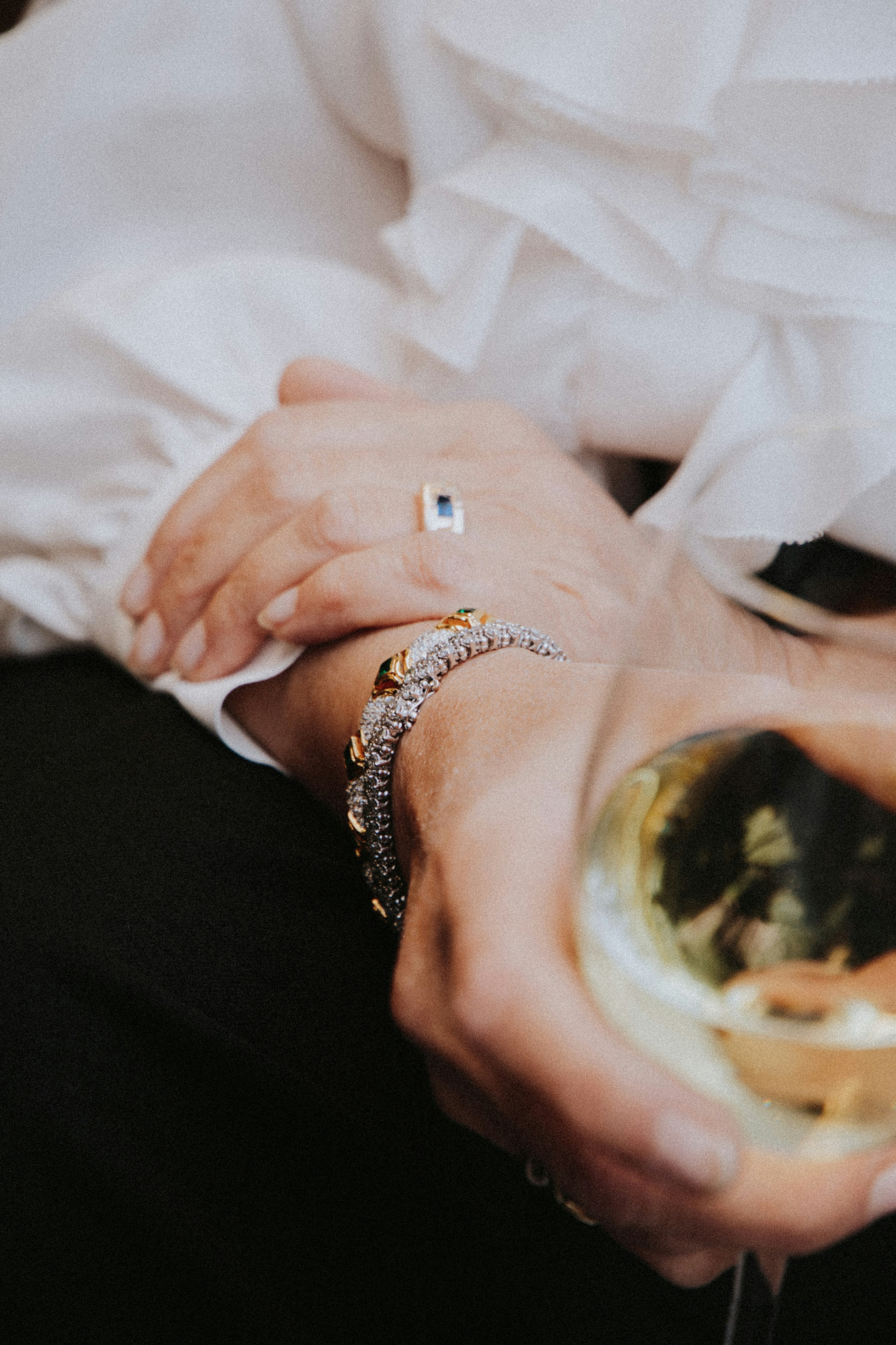 person wearing silver and gold ring