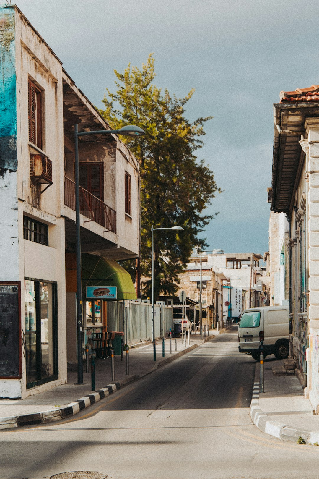 cars parked beside building during daytime