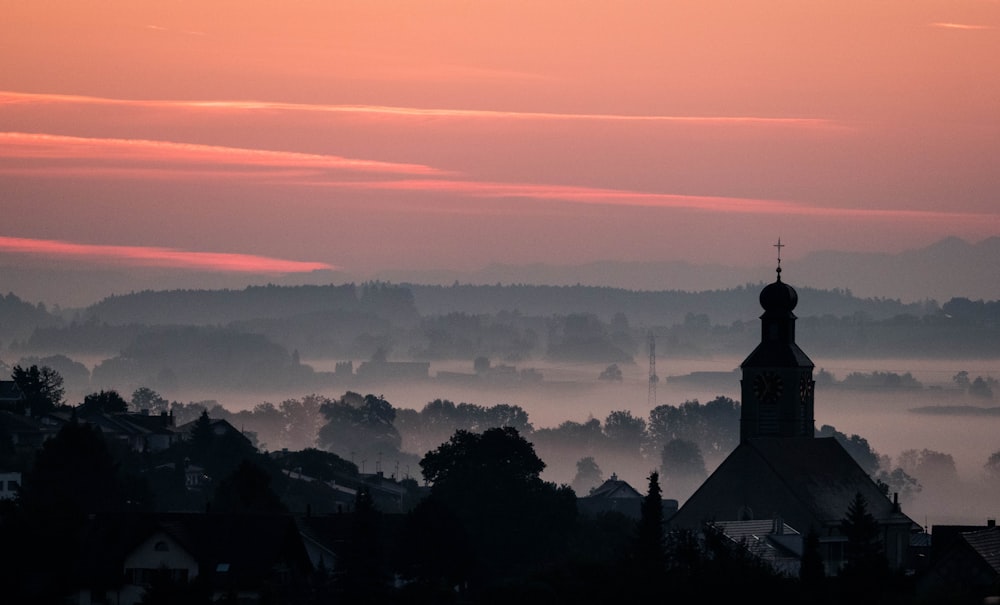 silhouette of building during sunset