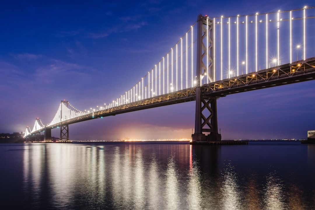 bridge over water under blue sky during daytime