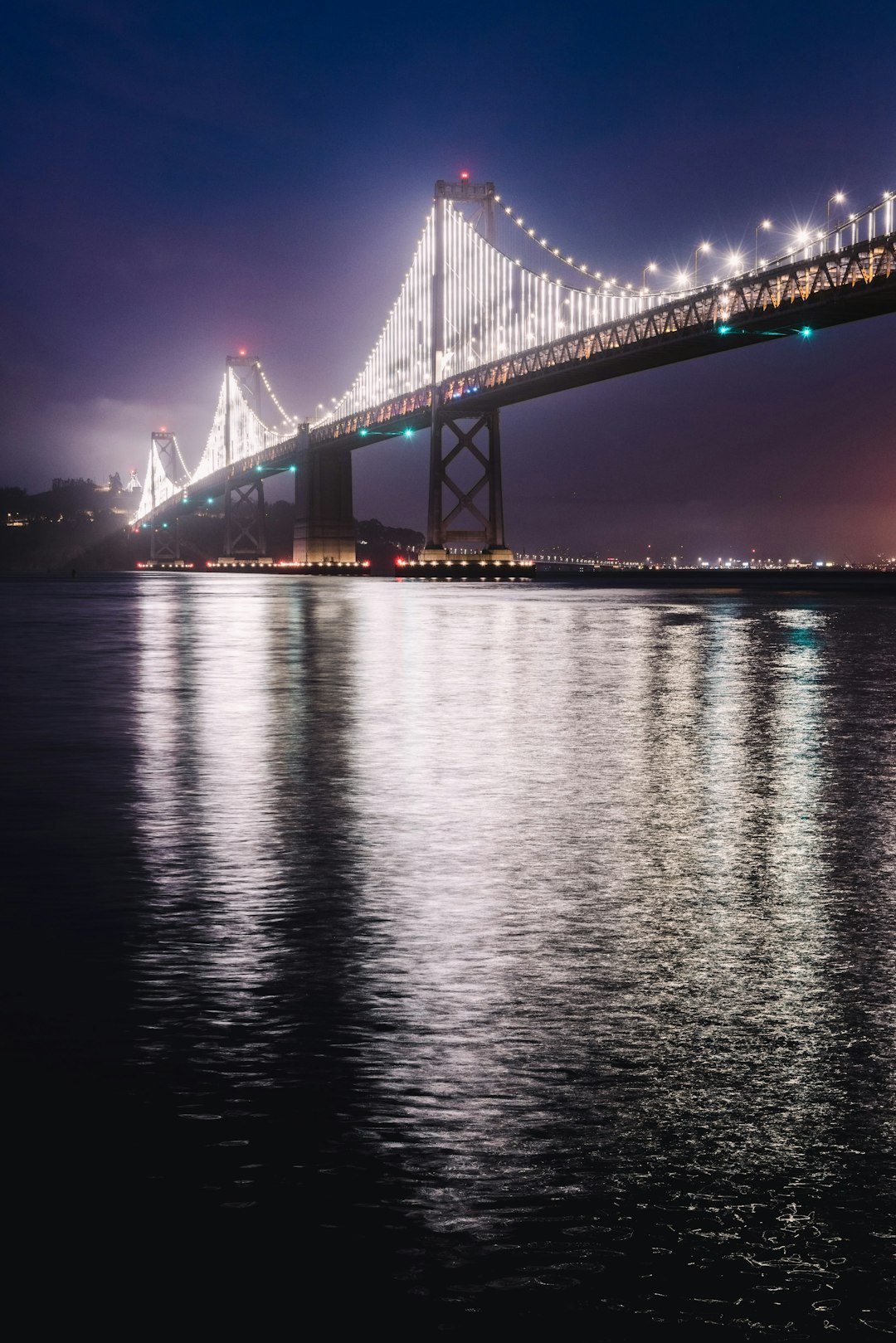 bridge over water during night time