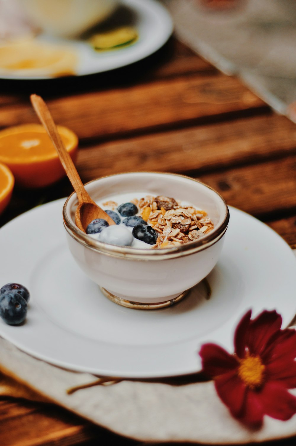 white ceramic bowl with cereal and spoon