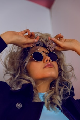 A model wearing oversized earrings that embody confidence and style.