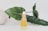 A bottle of skin care product labeled 'Sonia Roselli Water Oil Skin Prep' stands on a surface. Behind it, large green leaves and a white vase partially visible to the left create a natural backdrop. The product has a white and gold pump dispenser, with the body of the bottle in translucent ivory, giving a luxurious and fresh appearance.