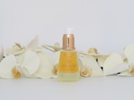 white and gold perfume bottle
