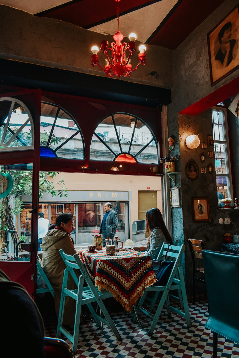 people sitting on chair inside restaurant