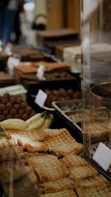 Assorted breads and pastries displayed on a wooden table