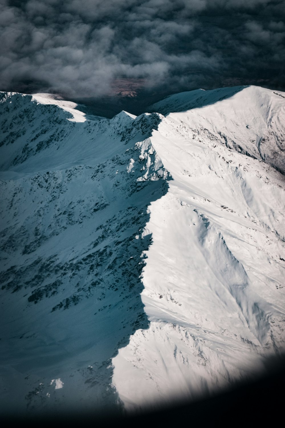 snow covered mountain during daytime