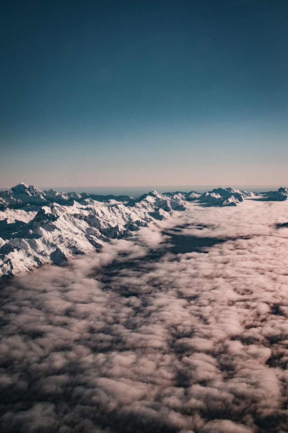 snow covered mountain under blue sky during daytime