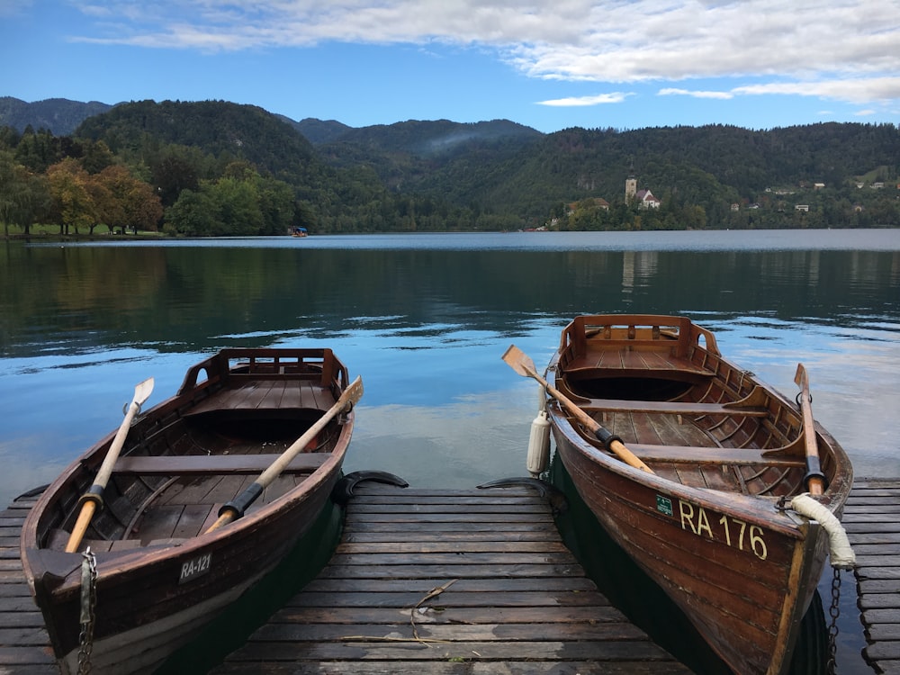 brown wooden boat on dock during daytime