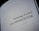 A close-up view of a book page with the text 'Technology is a tool, not a substitute for living.' printed in black letters.