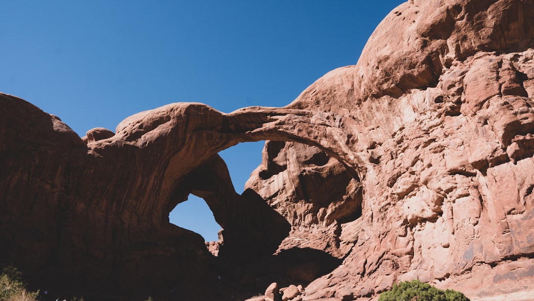 brown rock formation under blue sky during daytime