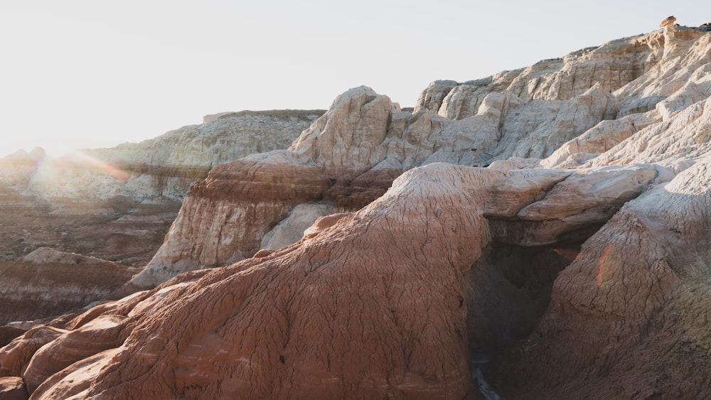 brown rock formation under white sky during daytime