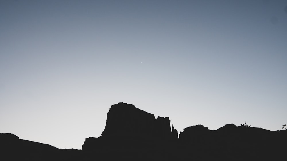 silhouette of mountain during sunset