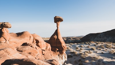 brown rock formation on brown rock formation during daytime balanced zoom background