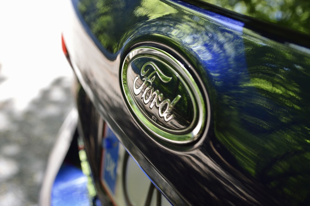 green and silver nissan car