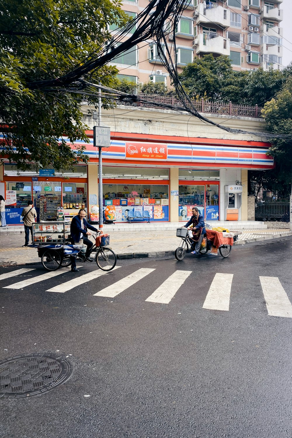 people riding bicycles on road during daytime