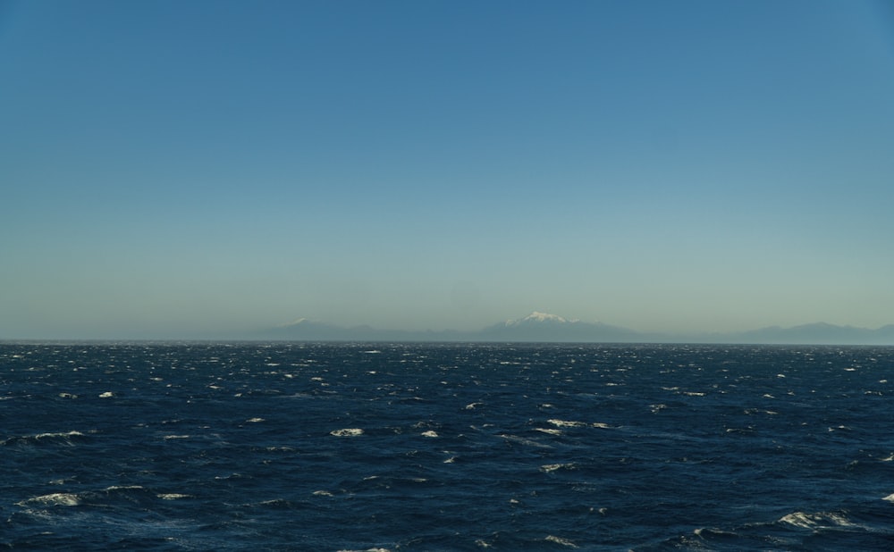 blue ocean water under blue sky during daytime