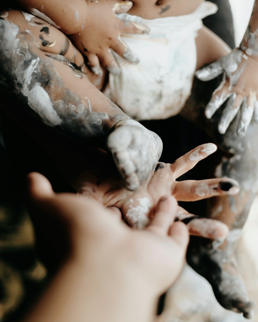 person with white powder on hand