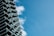 A completed residential building showcasing modern architecture against a clear blue sky.