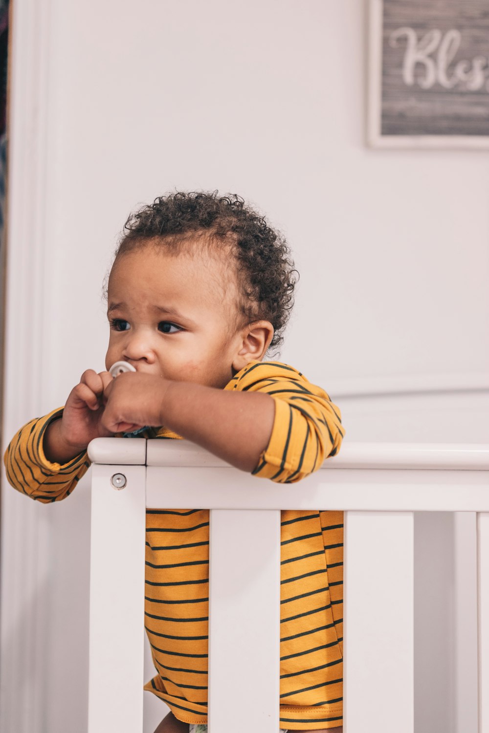 boy in yellow and black striped long sleeve shirt