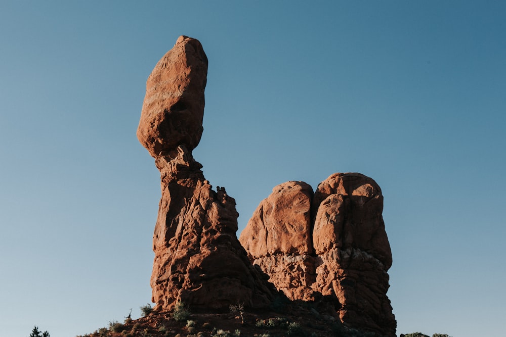 brown rock formation under blue sky during daytime