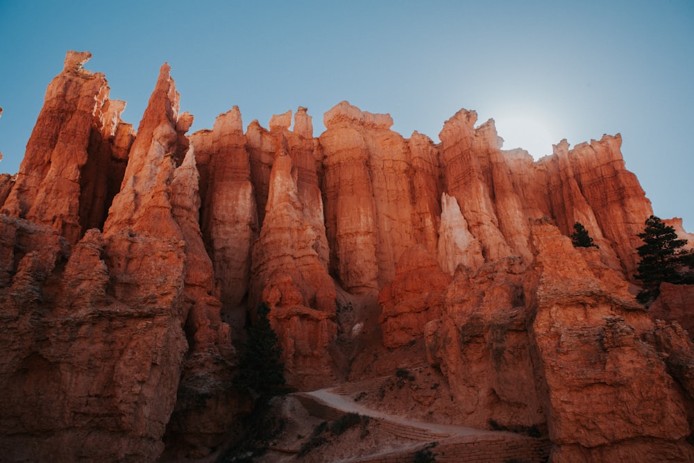 brown rock formation under blue sky during daytime