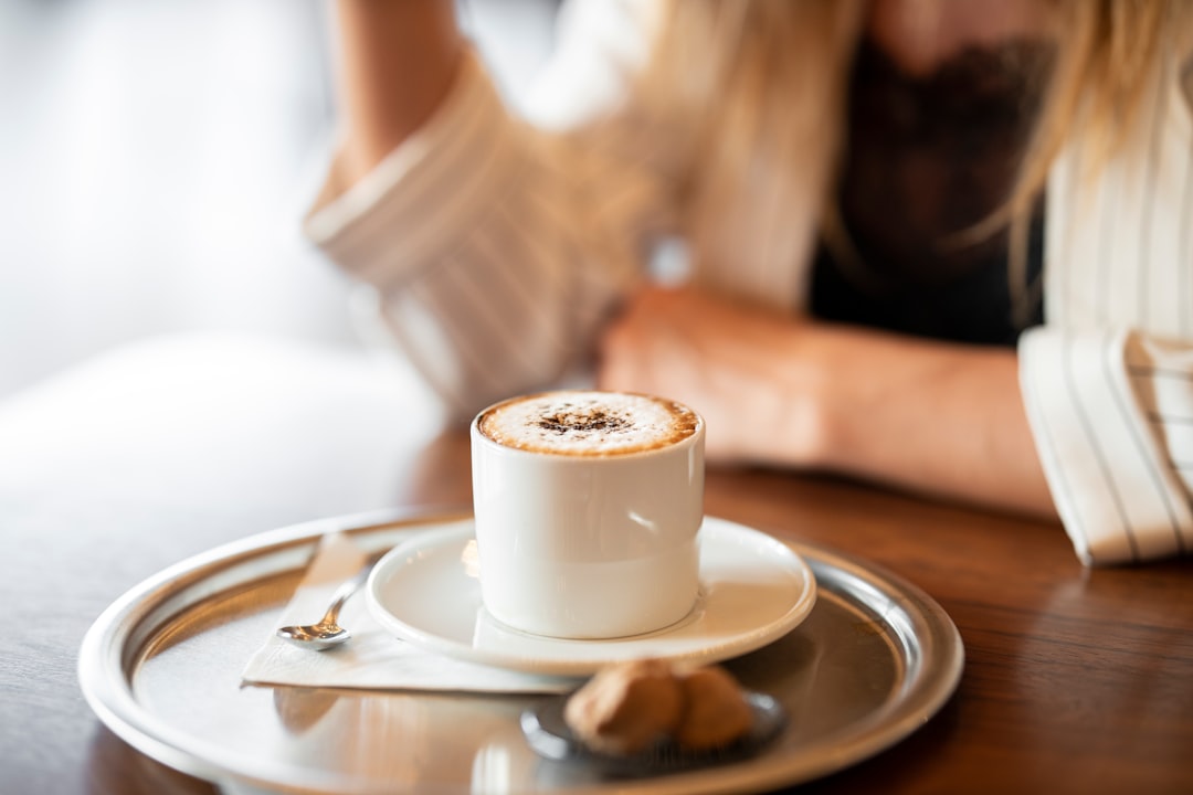 white ceramic cup on white ceramic saucer