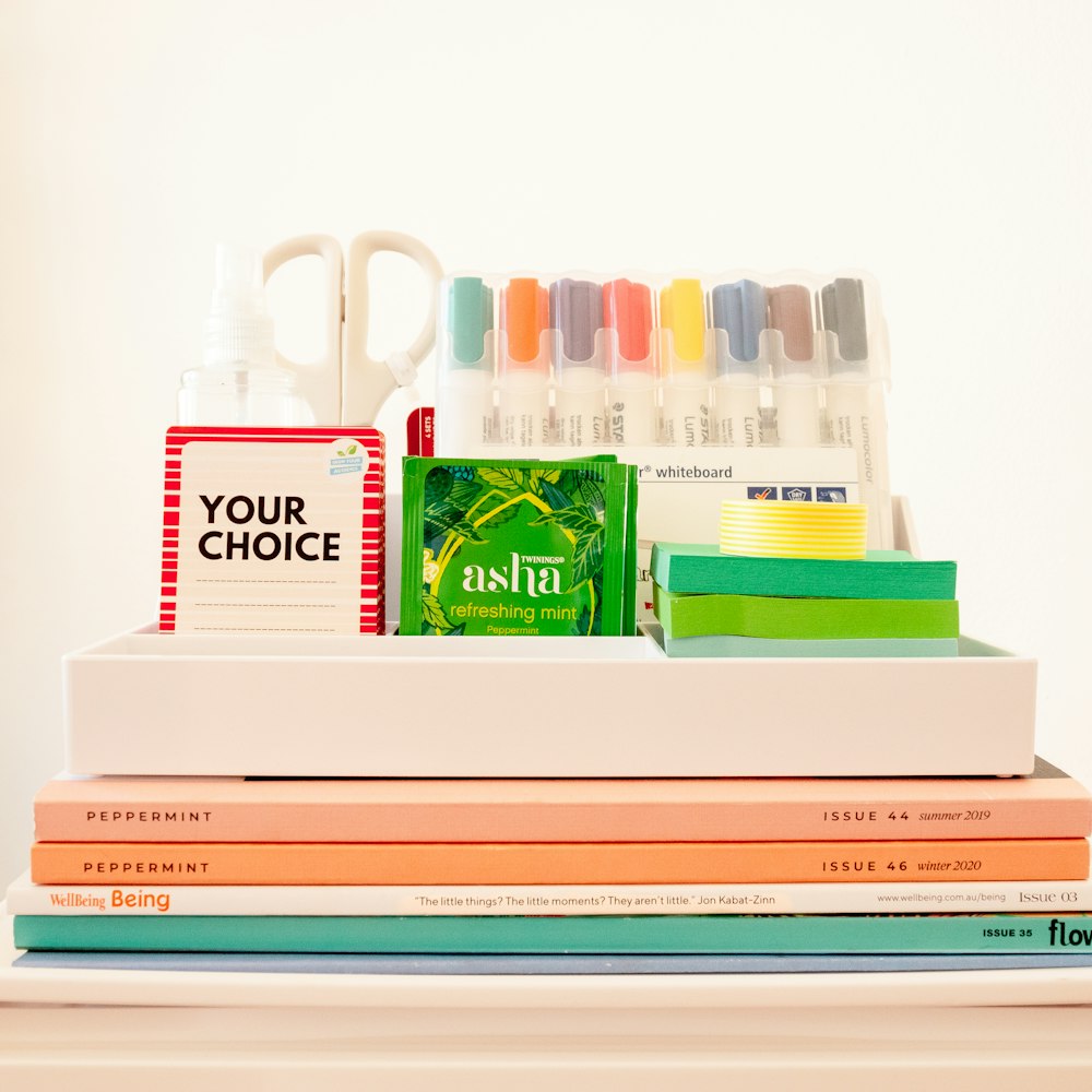 white ceramic mug beside books