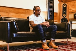 People enjoying a playback session in a cozy, blue-and-white themed room.