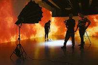 silhouette of people holding umbrella