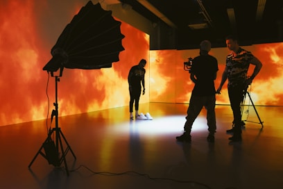 silhouette of people holding umbrella