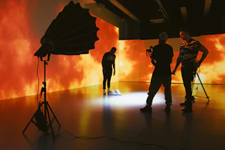 silhouette of people holding umbrella