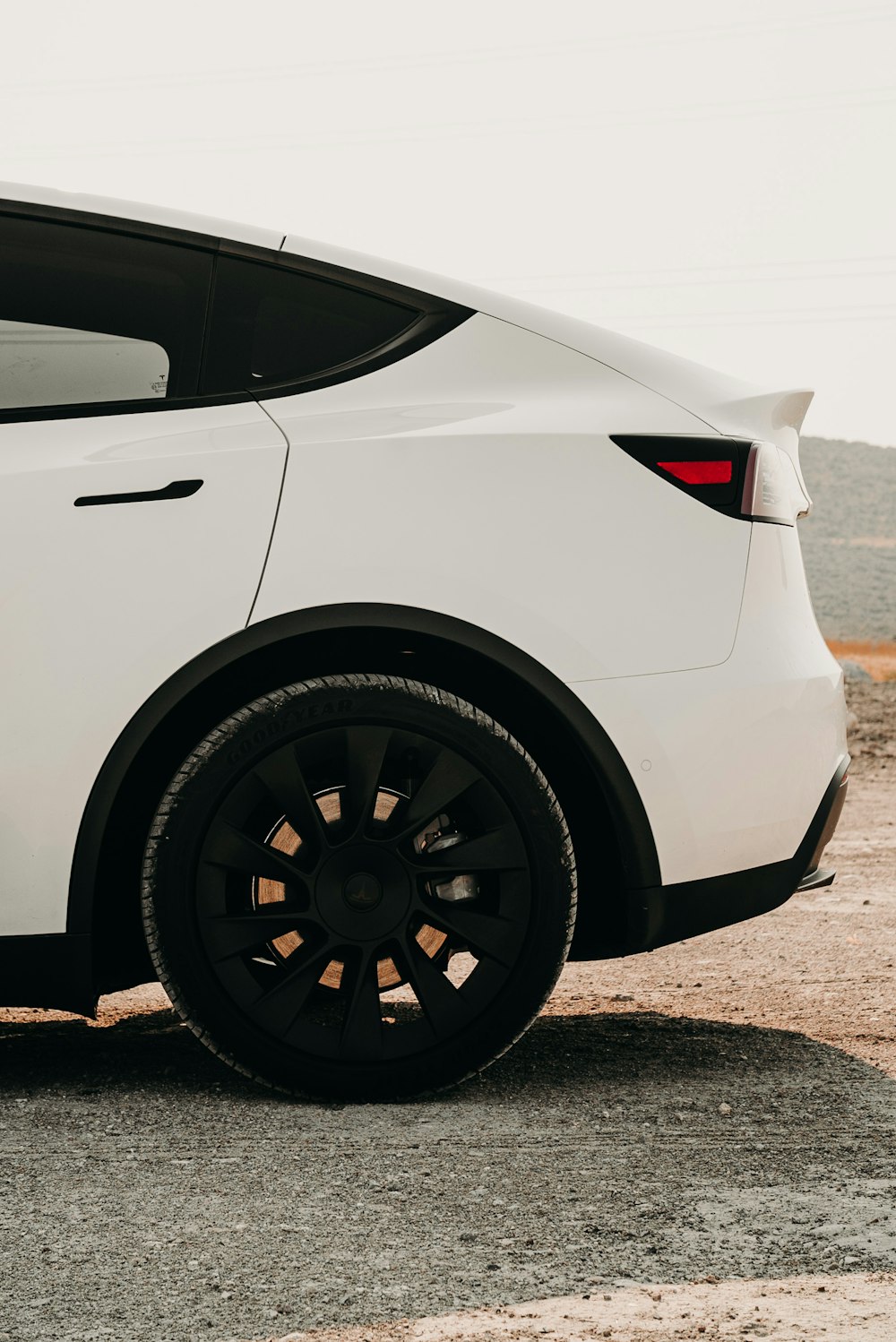 white car on gray concrete road