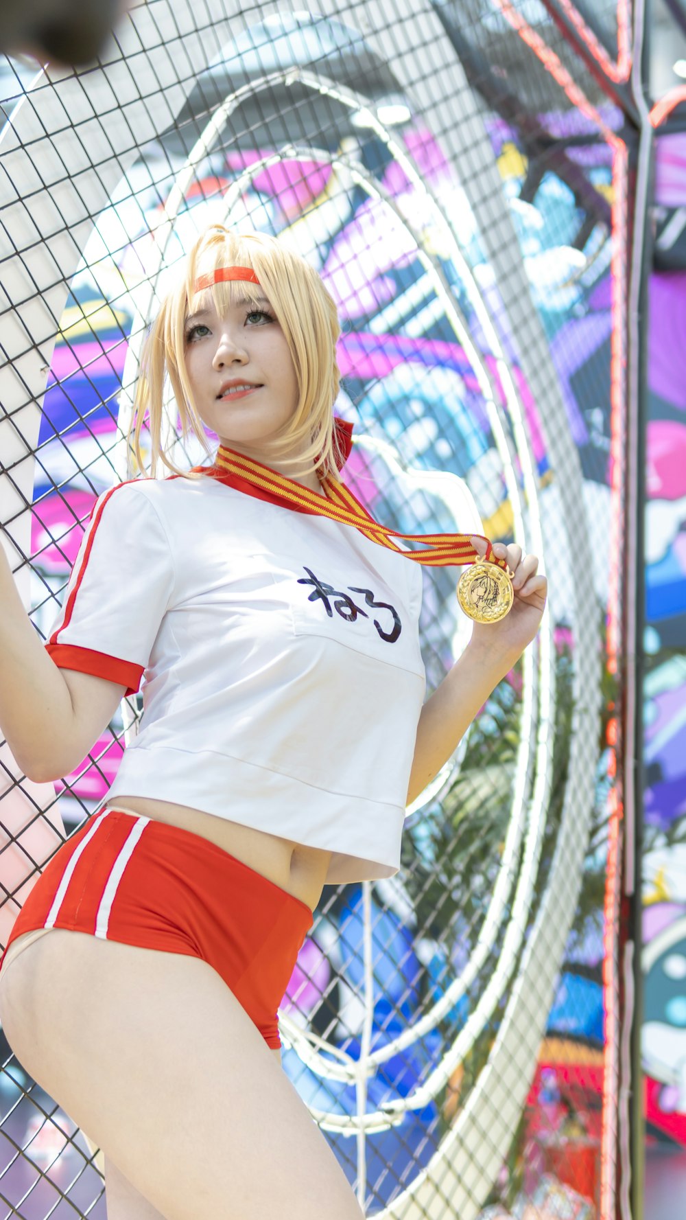 woman in white and red t-shirt and red shorts