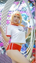 A person in a sporty outfit is posing in front of a colorful, graffiti-covered wall. They are wearing a white and red athletic attire with shorts, and they have a medal around their neck. The background is vibrant and filled with abstract designs and shapes.
