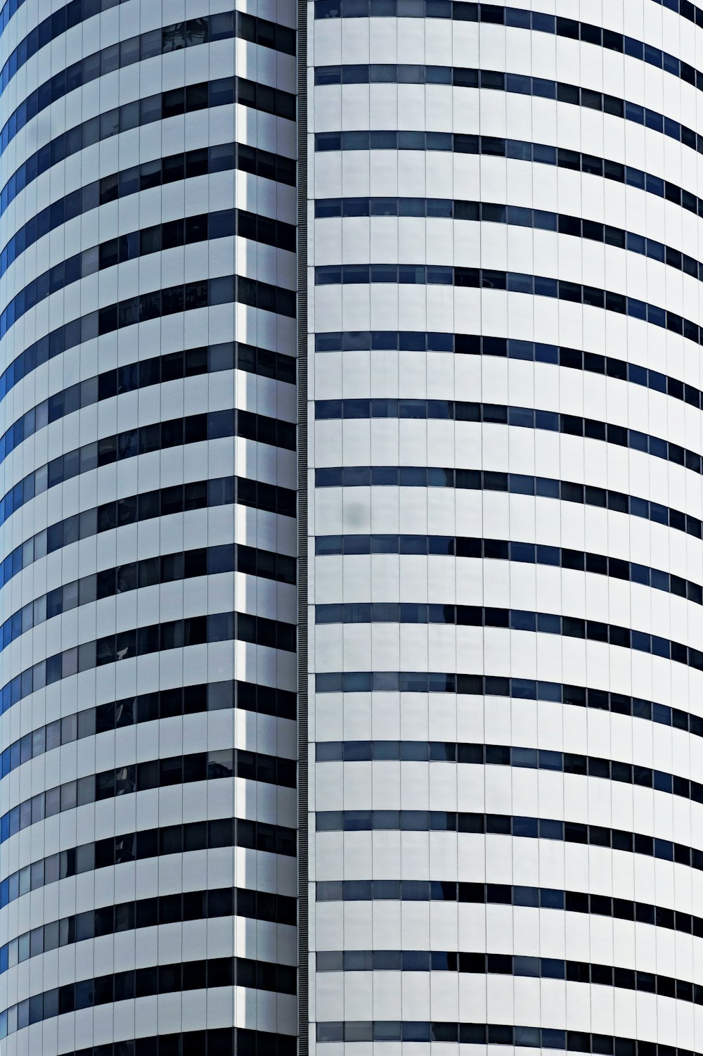 white and blue glass walled building