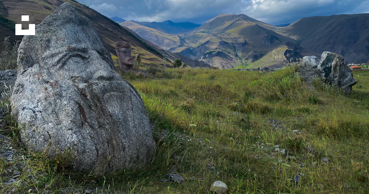 Gray rock on green grass field during daytime photo – Free Georgia ...