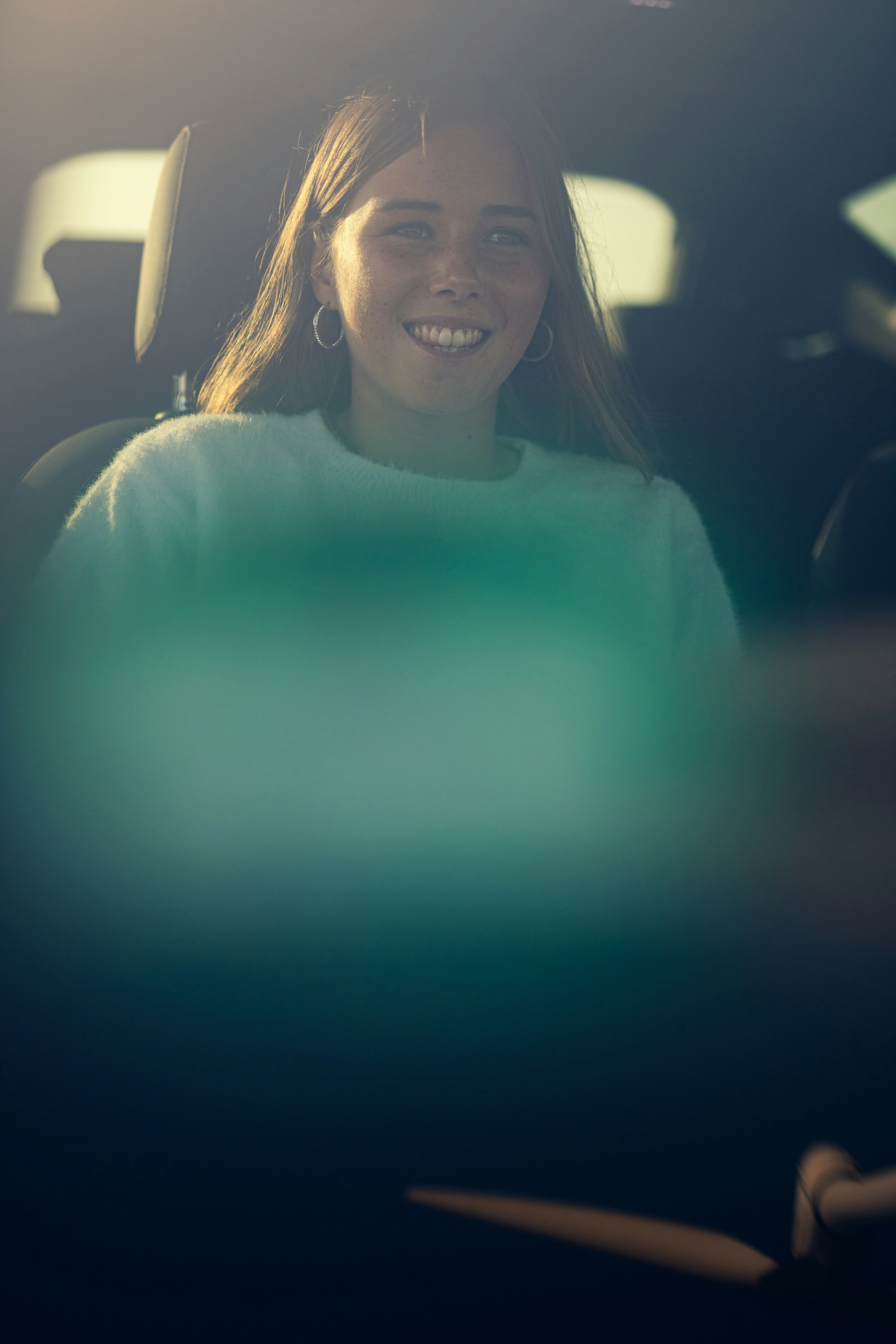 woman in green turtleneck sweater