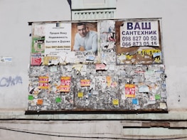 A community bulletin board filled with wanted posters and handwritten safety tips.